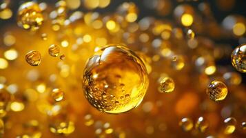 Close up of a yellow liquid with many small bubbles. The bubbles are of different sizes and are scattered throughout the liquid. The liquid appears to be a mixture of oil and water photo