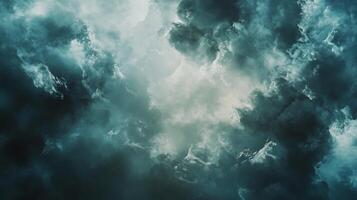The sky is filled with dark clouds, creating a moody and ominous atmosphere. The clouds are thick and heavy, and they seem to be looming over the horizon. Concept of foreboding and unease photo