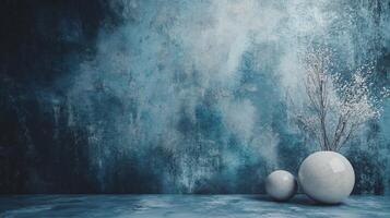 Blue wall with a vase and two white eggs on it. The vase is on the left and the eggs are on the right photo
