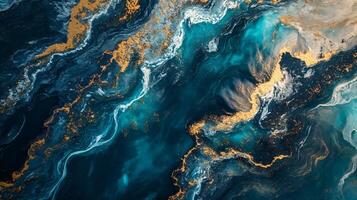 Blue ocean with gold and white swirls. The colors and patterns create a sense of movement and depth, making the ocean look like it's alive photo