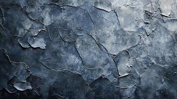 Wall with a blue and gray texture. The wall is covered in cracks and has a rough surface photo