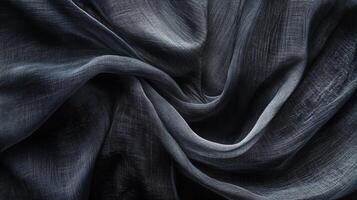 Black fabric with a pattern of lines and dots. The fabric is folded and has a shiny appearance photo