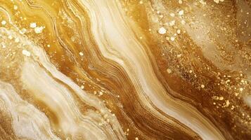 Gold and brown swirl pattern with glittery spots. The pattern is very detailed and has a lot of texture. The gold and brown colors give the impression of warmth and luxury photo