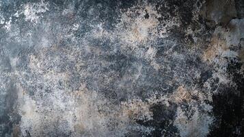 Wall with a lot of dirt and grime on it. The wall is grey and has a lot of texture photo