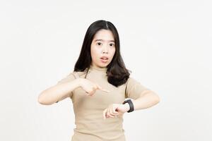 Pointing to watch, Angry for late Of Beautiful Asian Woman Isolated On White Background photo