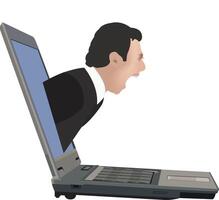 A man in a suit is yelling on a laptop vector