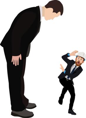 A man in a suit is standing next to a man in a hard hat