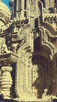 A towering building adorned with an intricate clock on its side video