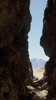 A narrow tunnel between two large rocks video