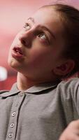 Psychotherapist focusing on a teenager with personal struggles and hormonal shifts in therapy session. Expert listening attentively, providing support for mental and social issues. Camera A. video