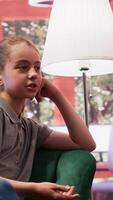 Therapist taking notes of the mental health progress with an adolescent in counseling, keeping track of her intrusive thoughts. Psychologist helping with social anxiety. Camera A. video