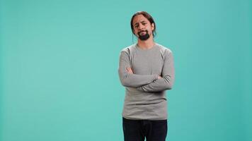 Man shakes head, showing negative emotion, showing lack of satisfaction, isolated over studio background. Irked person disagreeing with friend during conversation, studio backdrop, camera A video