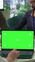 Vertical Investors group gathering in a meeting with chroma key screen on pc, discussing about potential business expansion plans. Examining reports for another investment, corporate briefing. Camera A. video