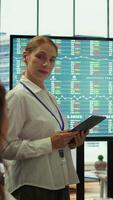 Vertical Business associates sharing ideas in a corporate briefing meeting, utilizing interactive boards to present detailed project reports and align on key performance indicators and objectives. Camera B. video