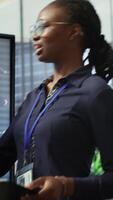 Vertical Team of company analysts reviews feedback on sales to work on future improvements, developing marketing and PR strategies in meeting room. Startup enterprise affiliates. Camera A. video