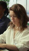 Vertical Project leader and her staff conducting a market research for progress plans, learning the trends. Forecast affiliates working on infrastructure investments to fulfill objectives. Camera B. video