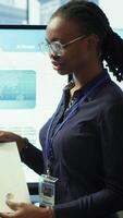 Vertical In a high end boardroom, employees gather to brainstorm ideas and create strategies, analyzing statistics to drive business development and ensure successful project. Enterprise solutions. Camera A. video