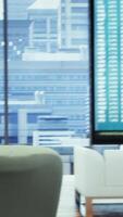 Vertical Empty boardroom setup with a computer displaying financial data, facilitates effective communication and strategy development for a successful business project. Performance goals. video
