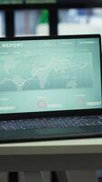 Vertical High end business office with a computer displaying detailed analytics, perfect for executive company meetings or financial planning and project development in a multinational corporation. video