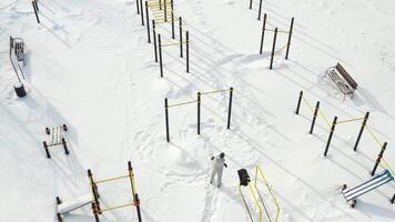 Top view of an empty sports field in a winter park. Infrastructure for winter sports video