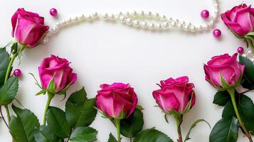 Pink roses and pearls on a white background photo