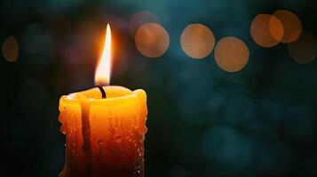 A candle is lit in the dark photo