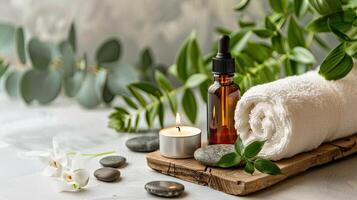 Spa products on a wooden tray with a candle and eucalyptus leaves photo