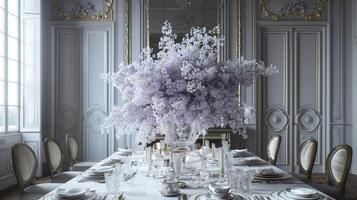 A table with purple flowers and silverware photo