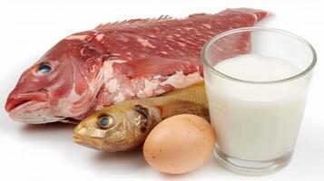 Fish, eggs and milk on a white background photo