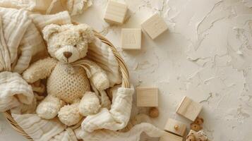 A teddy bear is sitting in a basket with wooden blocks photo