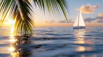 A sailboat is floating in the ocean near palm trees photo