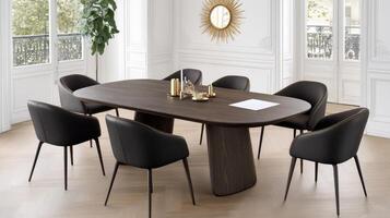 A modern dining table with black chairs photo