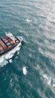 An aerial view of a container ship traveling through the ocean photo