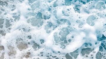 A close up of a wave with white foam photo