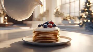 A stack of pancakes with berries and cream on top photo