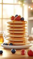 A stack of pancakes with syrup and berries photo