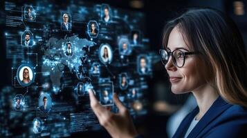 A woman in a business suit is pointing at a screen with social icons photo