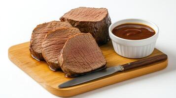 A piece of meat on a cutting board with a knife photo