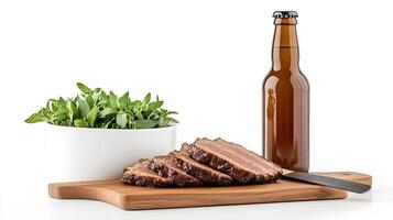 A bottle of beer and a cutting board with meat photo
