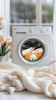 A washing machine with a towel and a baby in it photo