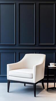 A white chair and table in front of a black wall photo