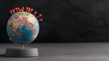 A globe with pins on it and pins on it photo