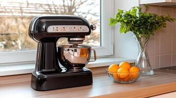 A kitchen counter with a blender and a bowl of lemons photo