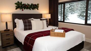 A bed with a red blanket and a basket of gifts photo