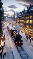 A train is traveling down the tracks in a snowy city photo