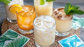 A group of drinks with ice and lemon slices photo