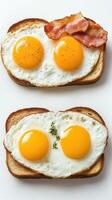 Two slices of bread with eggs and bacon on them photo