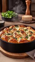 A pizza with cheese and broccoli in a pan photo