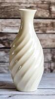 A white vase with a wavy design on it photo