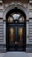 A black door with ornate details on the side photo